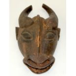 A TRIBAL BAMILEKE BUFFALO MASK. Cameroon. 25cm x12cm x 46cm