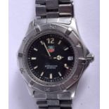 A TAGHEUER BLACK DIAL PROFESSIONAL WRISTWATCH. 3.5 cm wide.