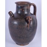 A CHINESE BROWN GLAZED POTTERY EWER. 19 cm high.