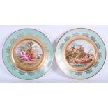 A PAIR OF EARLY 20TH CENTURY VIENNA PORCELAIN CABINET PLATES. 24 cm diameter.