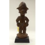 A TRIBAL YOROUBA FIGURE. Nigeria. 11cm x 10cm x 30cm