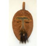 A TRIBAL DAN MASK. Ivory Coast. 16cm x 9cm x 25cm