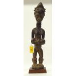 A TRIBAL BAULE MATERNITY FIGURE. Ivory Coast. 10cm x 10cm x 44cm