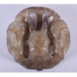 A CHINESE MUTTON JADE ROUNDEL. 4.75 cm wide.