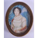 A GEORGE III PAINTED IVORY PORTRAIT MINIATURE depicting a female within a blue interior. Image 5 cm