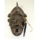 A TRIBAL LIGBI MASK. Ivory Coast. 19cm x 10cm x 36cm