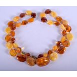 AN AMBER BEAD NECKLACE. 37 grams. 70 cm long.