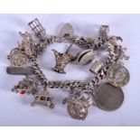 A VINTAGE SILVER CHARM BRACELET. 94 grams.