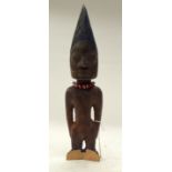 A TRIBAL YORUBA IBEJI FIGURE. Nigeria. 9cm x 9cm x 37cm