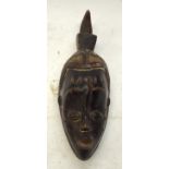 A TRIBAL GURO GU MASK. Ivory Coast. 12cm x 12cm x 35cm