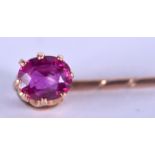 AN ANTIQUE GOLD AND RUBY TIE PIN. 1.3 grams. 6.25 cm long.
