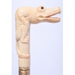 A CONTINENTAL CARVED BONE WALKING CANE. 93 cm long.