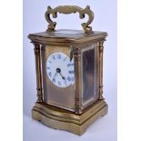 AN ANTIQUE BRASS CARRIAGE CLOCK. 14 cm high inc handle.