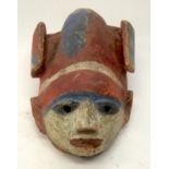 A TRIBAL YORUBA GELEDE HELMET MASK. Nigeria. 21cm x 16cm x 36cm