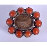 A VICTORIAN YELLOW METAL AND CORAL BROOCH. 2 cm x 2 cm.