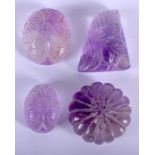 FOUR MIDDLE EASTERN CARVED AMETHYST AMULETS. (4)