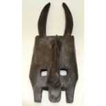 A TRIBAL MASK. 11cm x 24cm x 70cm