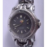 A BOXED VINTAGE TAGHEUER STAINLESS STEEL WRISTWATCH. 3.5 cm wide.