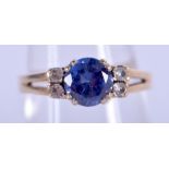 A VINTAGE 9CT GOLD 1.25 CT SAPPHIRE AND DIAMOND RING. P. 3.3 grams.