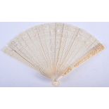 A FINE 19TH CENTURY CHINESE CANTON IVORY FAN Qing, of small proportions. 22 cm wide open.