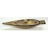 A TRIBAL AFRICAN BOAT. 15cm X 11cm X 69cm