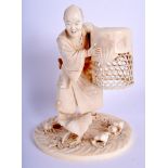 A FINE 19TH CENTURY JAPANESE MEIJI PERIOD CARVED IVORY OKIMONO modelled as a male catching chickens