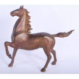 A JAPANESE TAISHO PERIOD BRONZE HORSE. 33 cm x 26 cm.