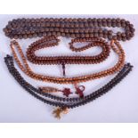 FOUR CHINESE CARVED BEAD NECKLACES. Longest 106 cm long. (4)