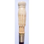 A CONTINENTAL CARVED BONE WALKING CANE. 93 cm long.