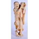 A 19TH CENTURY JAPANESE MEIJI PERIOD CARVED BONE FIGURE OF A MALE modelled holding toads. 12.5 cm h