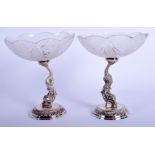 A PAIR OF SILVER PLATED CUT GLASS COMPORTS. 13.5 cm high.