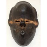 A TRIBAL TANGAGLE DAN MASK. Ivory Coast. 15cm x 9cm x 24cm