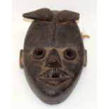 A TRIBAL DAN BUGLE MASK. Ivory Coast. 16cm x 10cm x 23cm