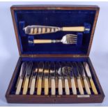 A CASED SET OF ANTIQUE SILVER COLLARED IVORY FISH KNIVES AND FORKS. (26)
