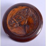 A 1920S EQUESTRIAN CARVED WOOD SNUFF BOX. 7.5 cm diameter.