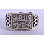 AN ISLAMIC WHITE METAL RING.