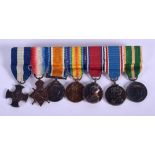 A MINIATURE GROUP OF MILITARY MEDALS including the distinguised cross. (7)
