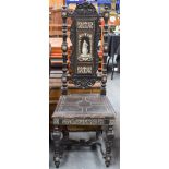 A 19TH CENTURY CONTINENTAL IVORY INLAID EBONISED HALL CHAIR decorated with a figure amongst foliage.