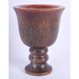A CHINESE CARVED BUFFALO HORN TYPE LIBATION CUP. 9 cm x 7 cm.