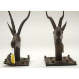 TWO TRIBAL CARVED ANTELOPE HEADS. (2)