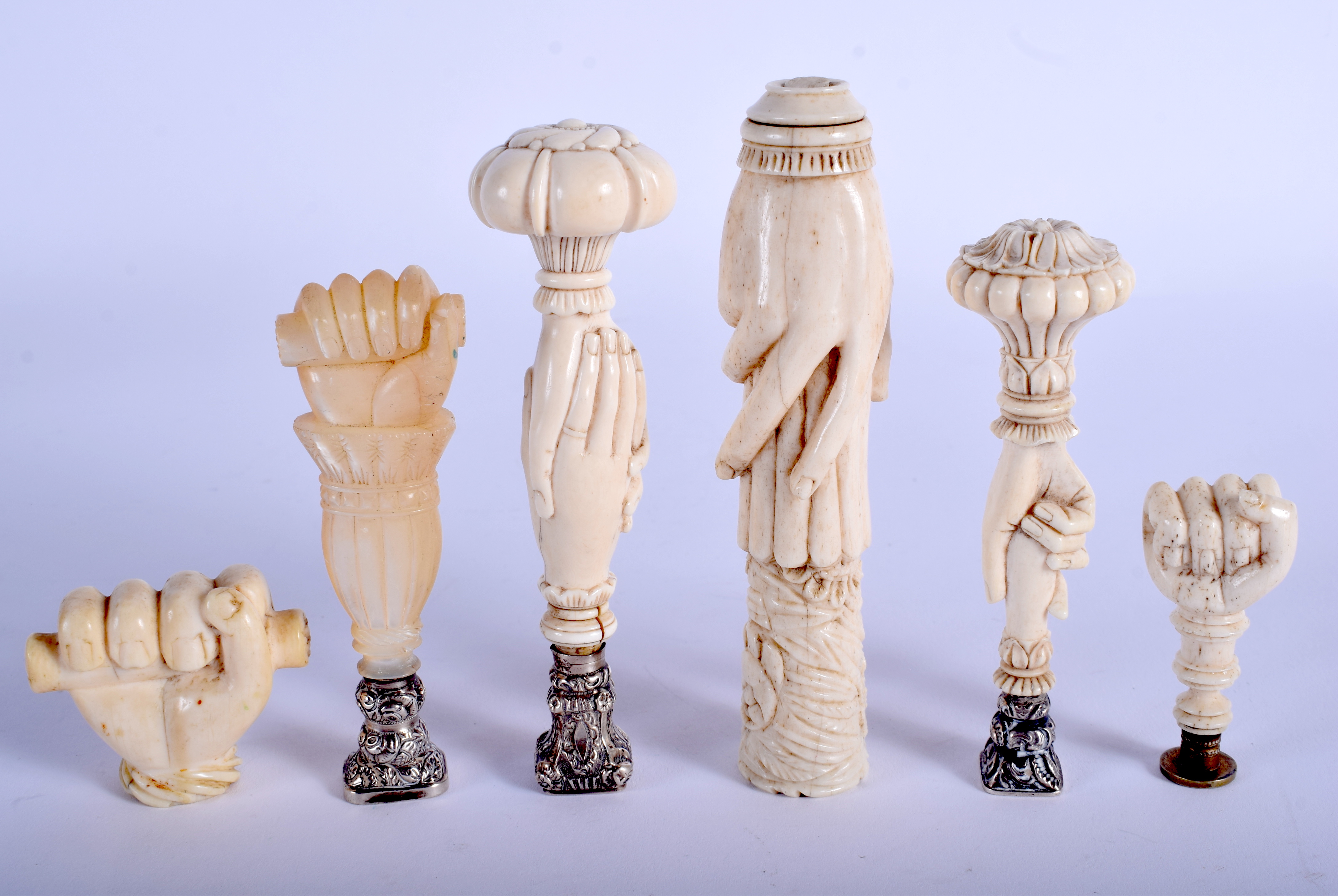 SIX 18TH/19TH CENTURY CARVED IVORY AND MOTHER OF PEARL SEALS in various forms. Largest 10.5 cm high.