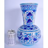 A 19TH CENTURY PERSIAN BLUE AND WHITE FAIENCE VASE painted with floral sprays. 30 cm high.