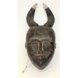 A TRIBAL BAULE MASK. Ivory Coast. 15cm x 8cm x 40cm