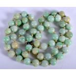 A 1930S 9CT GOLD AND JADEITE NECKLACE. 56 cm long.