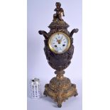 A LARGE 19TH CENTURY FRENCH GILT METAL MANTLE CLOCK decorated with putti in various pursuits. 52 cm