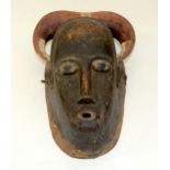 A TRIBAL GURO MASK. Ivory Coast. 22cm x 14cm x 30cm