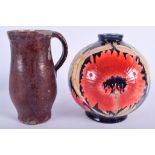 AN ANTIQUE ART POTTERY JUG together with a globular vase. 20 cm & 19 cm high. (2)