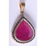 A 14CT GOLD AND RUBY PENDANT. 6.4 grams. 1.5 cm x 1.5 cm.