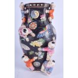 A 1950S CHINESE FAMILLE NOIRE BOYS VASE. 27.5 cm high.