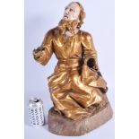 AN ANTIQUE NORTH EUROPEAN CARVED POLYCHROMED SANTOS FIGURE modelled upon a wooden base. 50 cm x 17 c